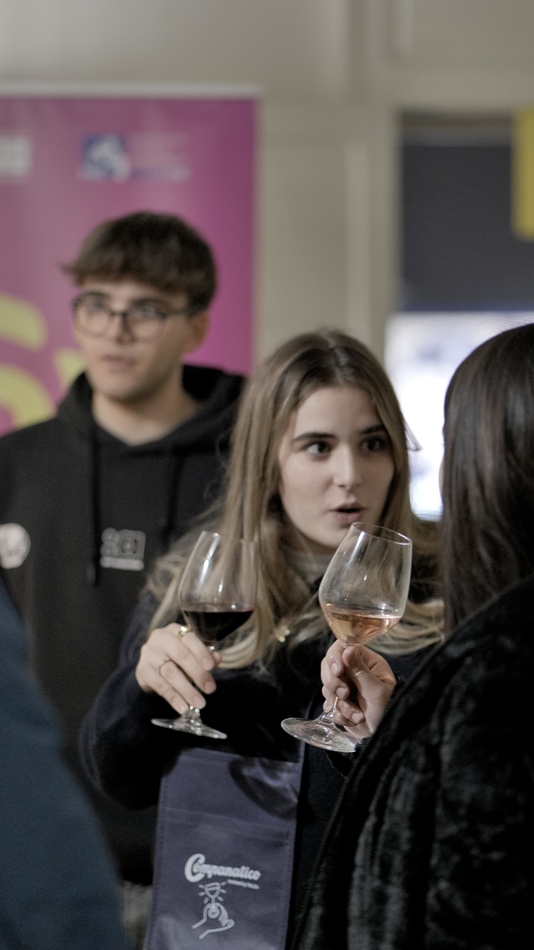 People talking while drinking wine
